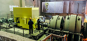 Electric motor coupled to cement mill